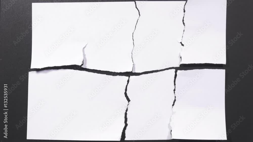 Separate pieces of white sheet of paper come together and join into one whole paper on black surface, bringing together torn apart parts, parts become one whole. Stop motion. Close up, 4K Ultra HD.