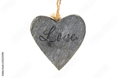 Isolated wooden heart with the word Love