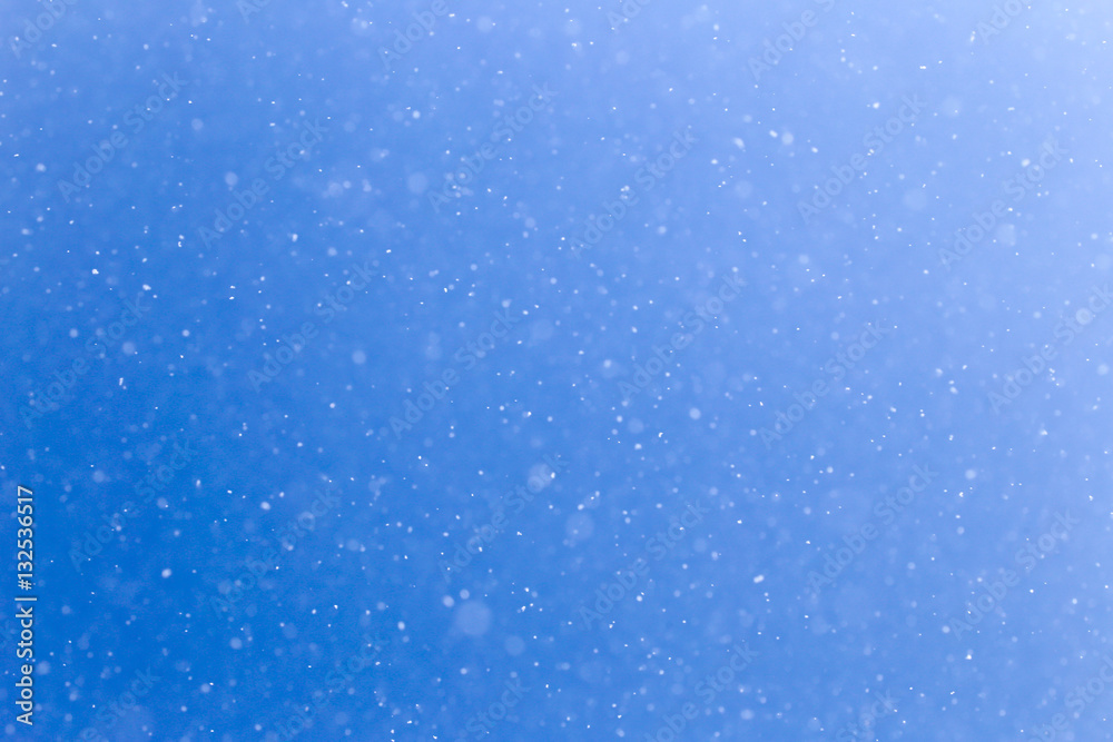 snowing on a blue sky snowing on a blue sky