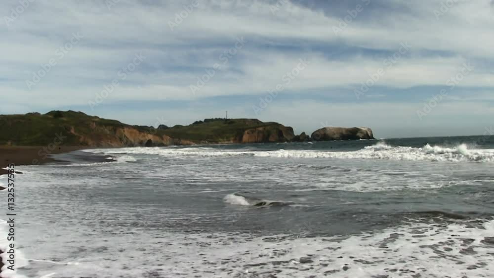 Ocean Waves On Sand Beach With Dirt Cliffs White Clouds Marin California Ocean Waves On Sand Beach With Dirt Cliffs White Clouds Marin California