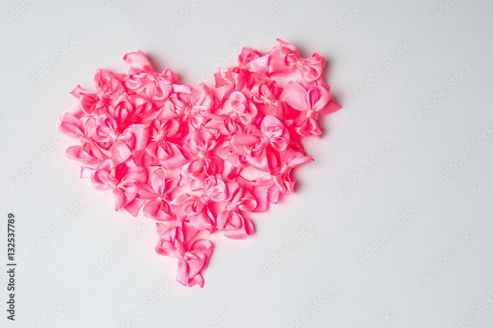 Heart shape made of pink ribbons