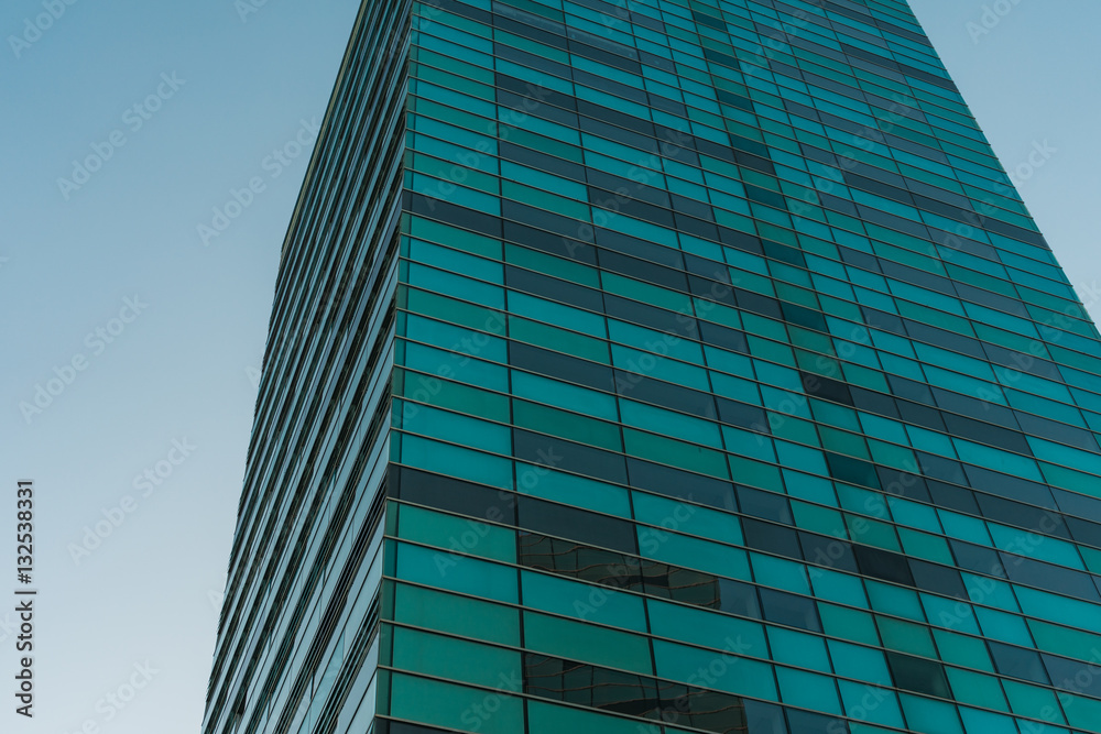 Obraz premium Green glass building detail view from low angle