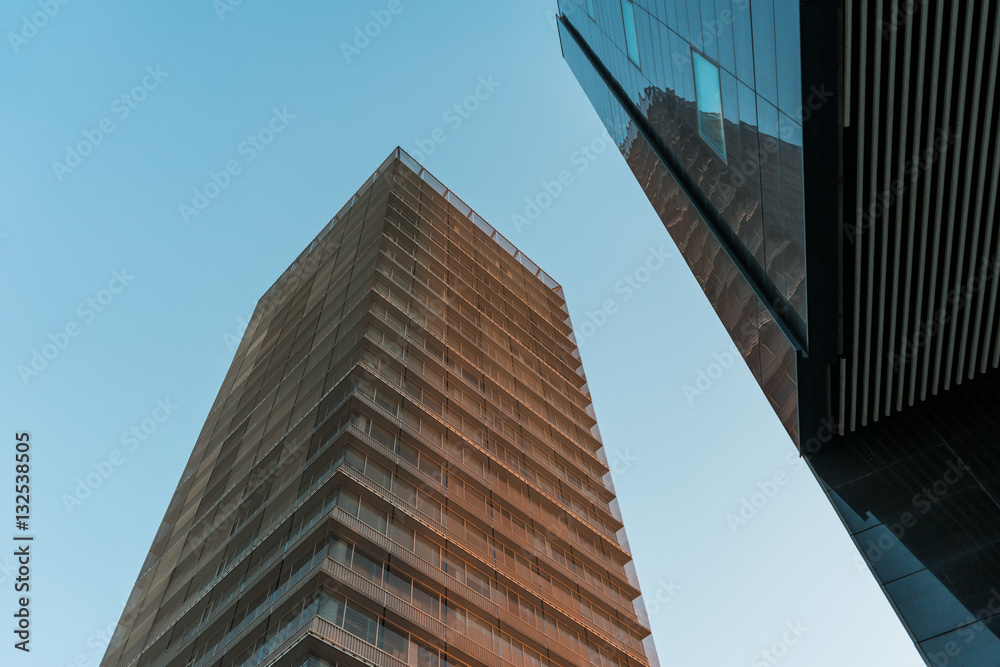 Low angle view on converging lines of buildings