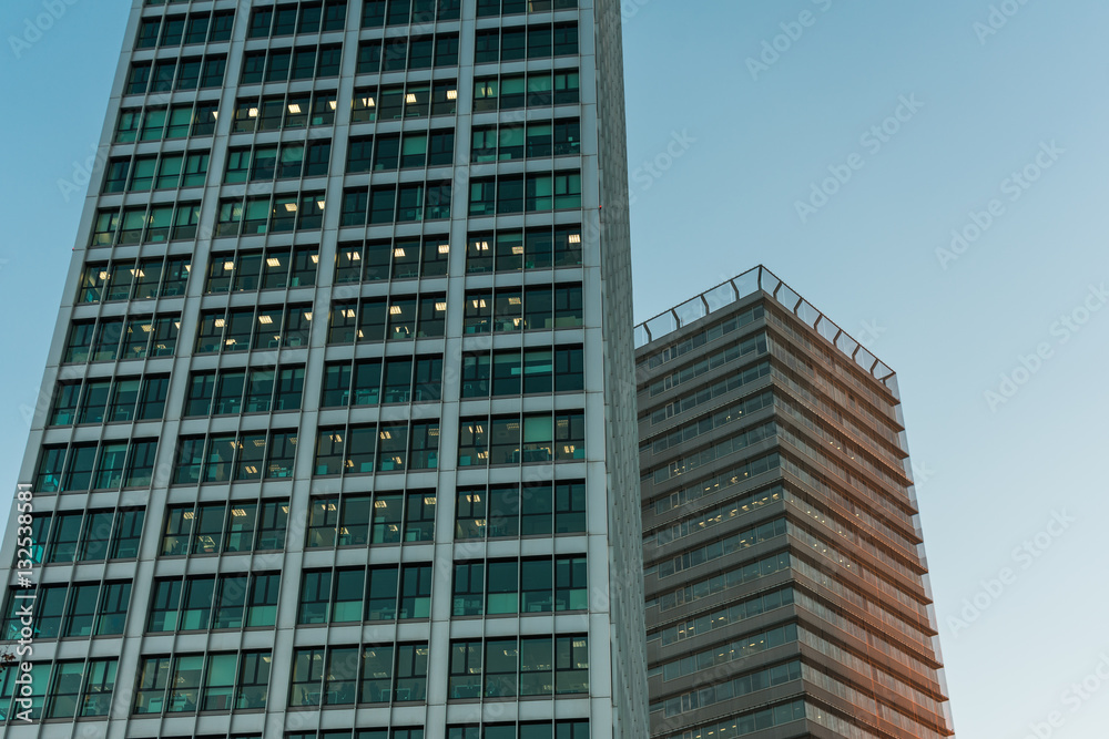 Low angle view of commercial buildings at twilight