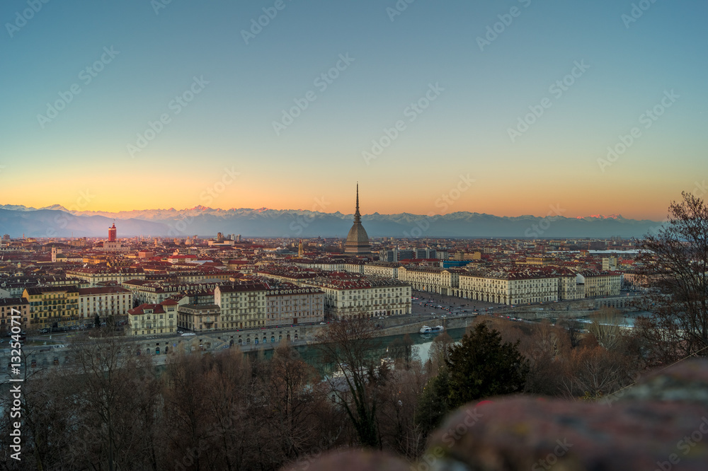 panorama of the city of turin from above at sunset with mole Antonelliana