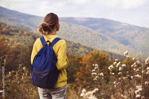 Young woman walking in the Carpathians Mountain