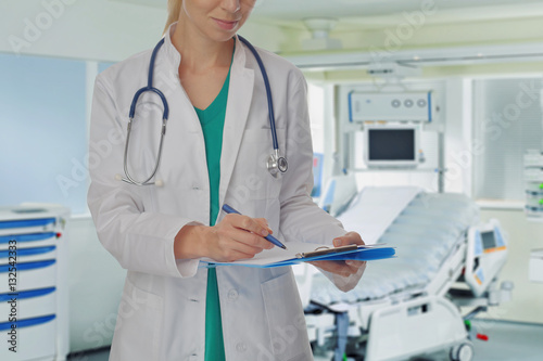 Female doctor with a stethoscope in hospital background. Health care and medical concept