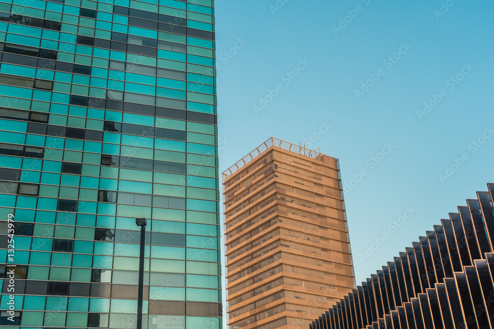 Fototapeta premium Large medium and small buildings in urban setting