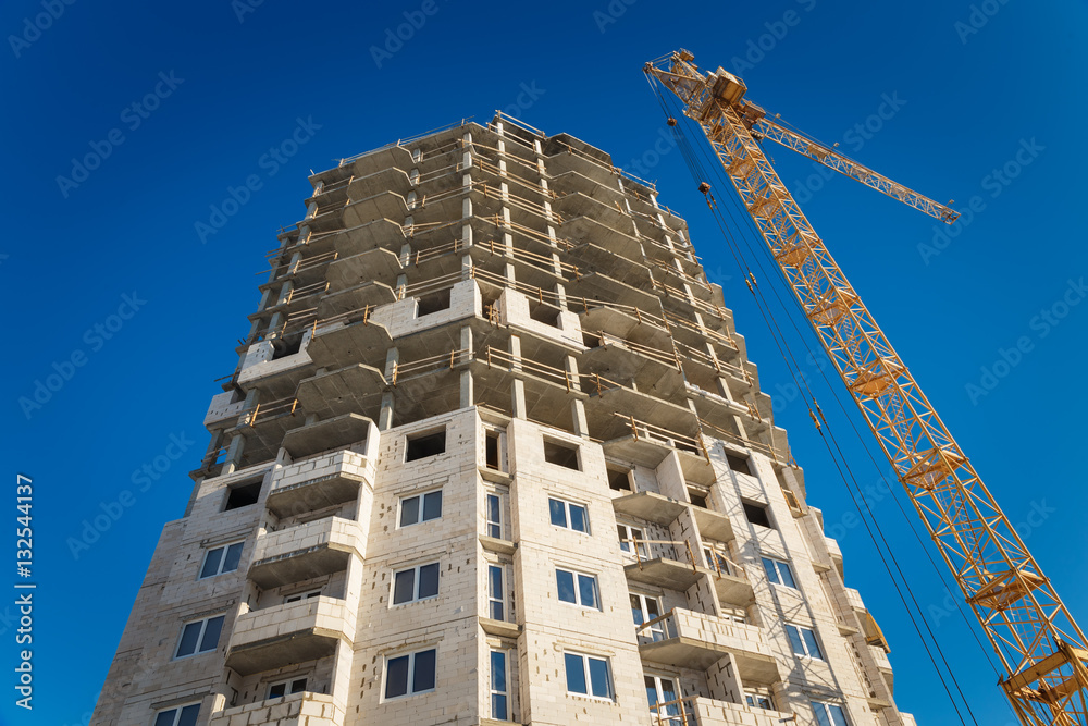 Fototapeta premium Two tower cranes building