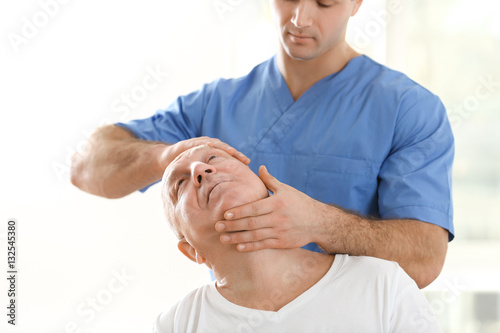 Physiotherapist working wit...