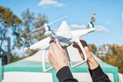 Hands holding copter