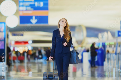 Young business woman in international airport