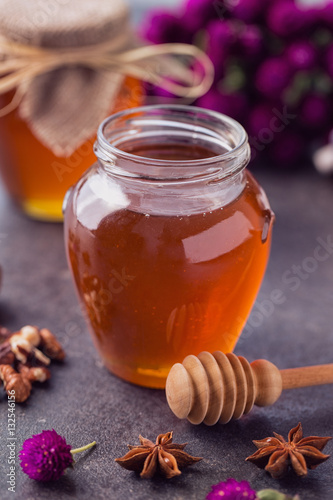 healthy honey in glass jar .