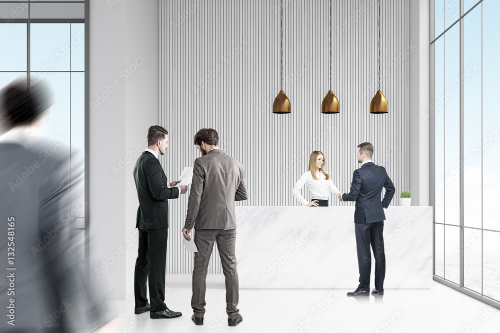 Business people near reception desk in office