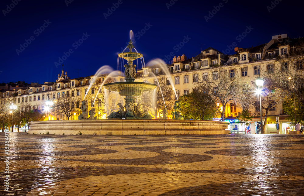Fountain in Rossio square Lisbon at night time