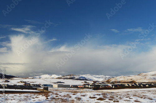 Winter scenery with snow and blue sky on Shetland Islands photo