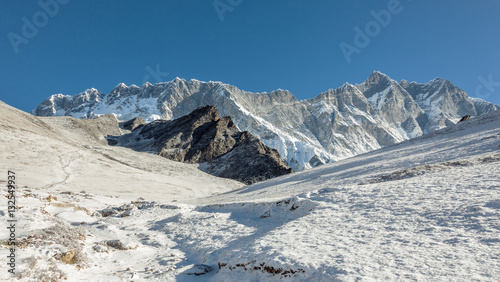 Panoramic view from the Chhukhung Ri at the fourth in the world in the height of mount Lhotse (8516 m) and the wall Nuptse (7864 m) - Everest region, Nepal, Himalayas photo