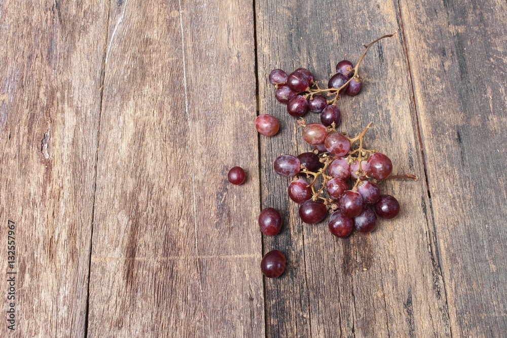 Grape red fresh Select focus with shallow depth of field on wooden table background Grape red fresh Select focus with shallow depth of field on wooden table background
