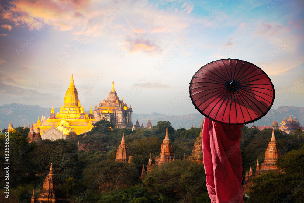 Monk standing with holding umbrella, Bagan Mandalay Myanmar