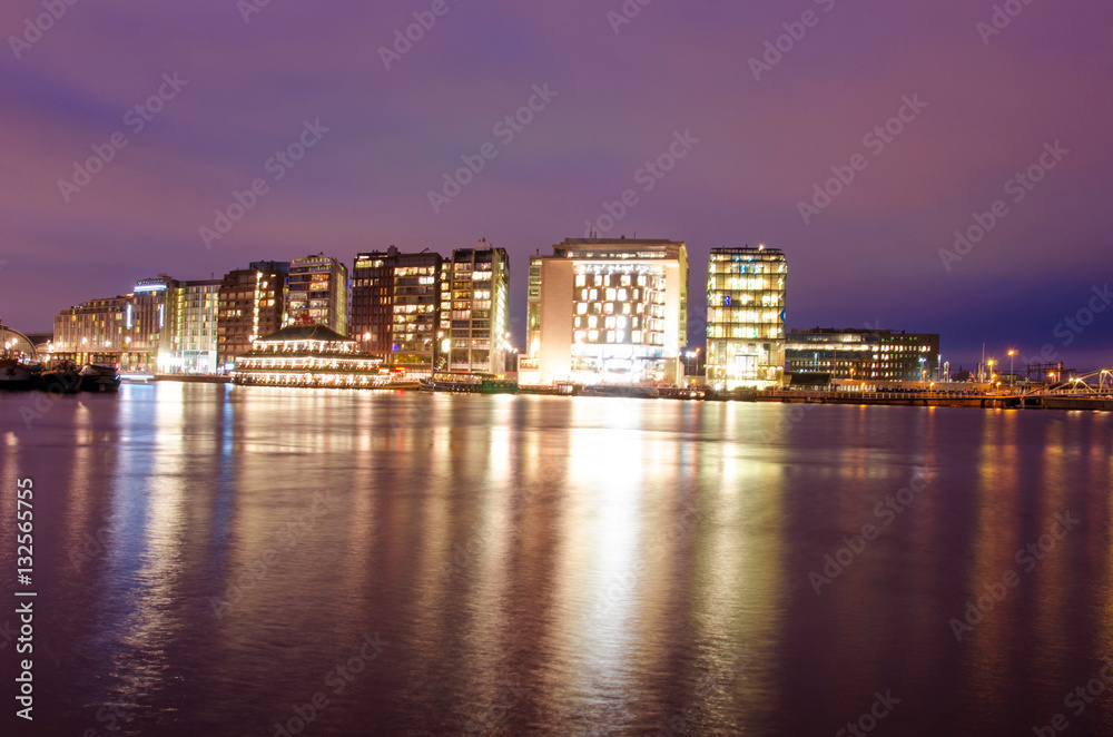 Modern houses on the canal in Amsterdam, Netherlands, Europe.