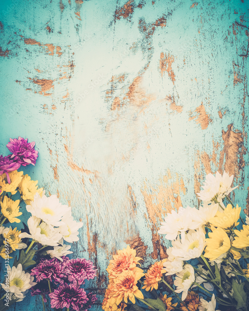 Colorful flowers bouquet on vintage wooden background, border design. vintage color tone - concept flower of spring or summer background