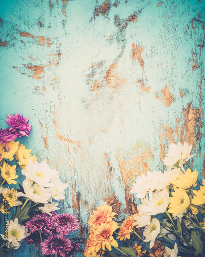 Colorful flowers bouquet on vintage wooden background, border design. vintage color tone - concept flower of spring or summer background
