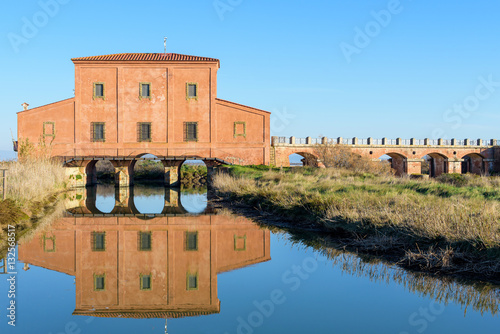 18th century red house in the natural reserve of Diaccia Botrona, Castiglione della Pescaia, tuscany, italy photo
