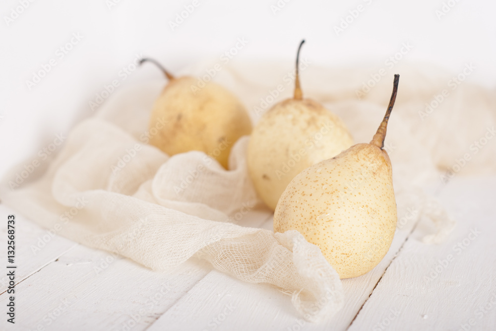 chinese pears on white wooden table chinese pears on white wooden table