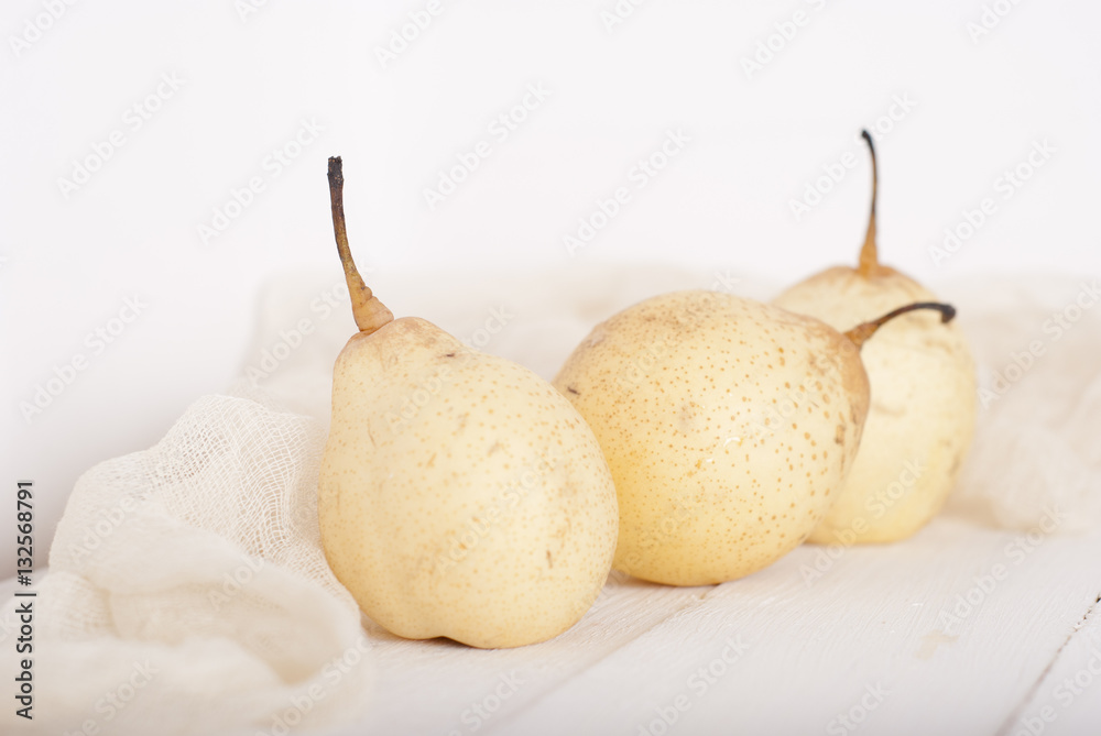 chinese pears on white wooden table chinese pears on white wooden table