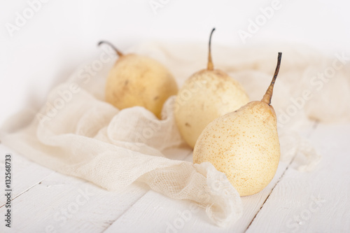 chinese pears on white wooden table