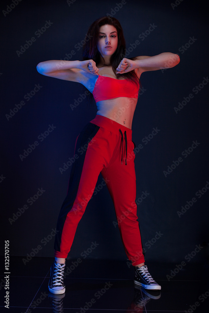 Funk dance workout. Portrait of young sporty woman in motion. 