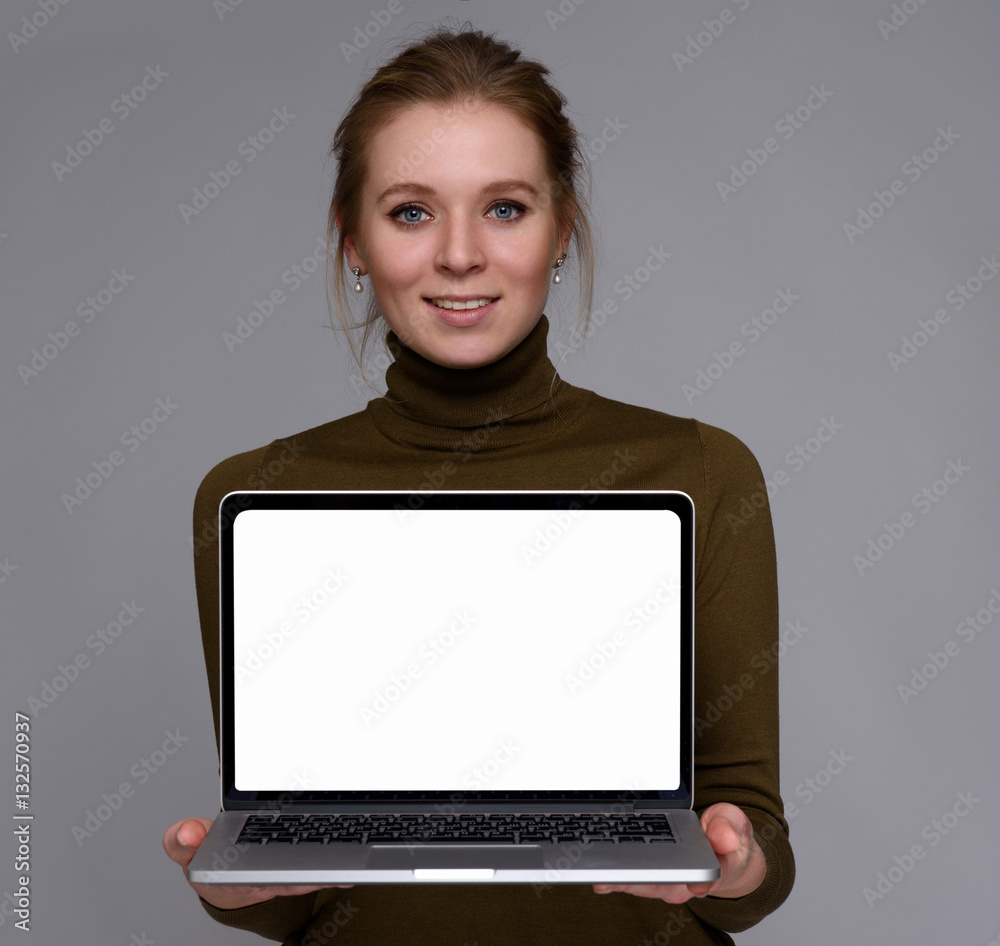 cute girl showing laptop with blank screen cute girl showing laptop with blank screen