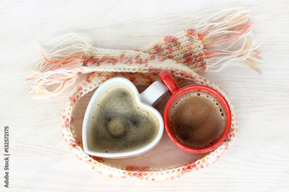 warming coffee break for two/ couple cups with drink are together wrapped scarf top view