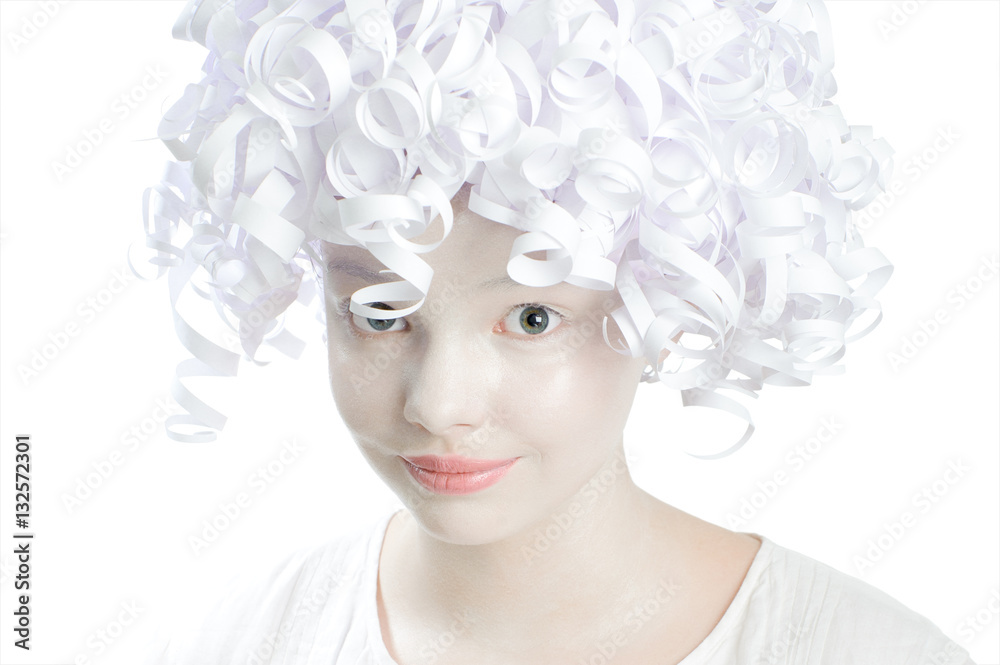 Portrait of a pretty girl with white theatrical makeup and curly