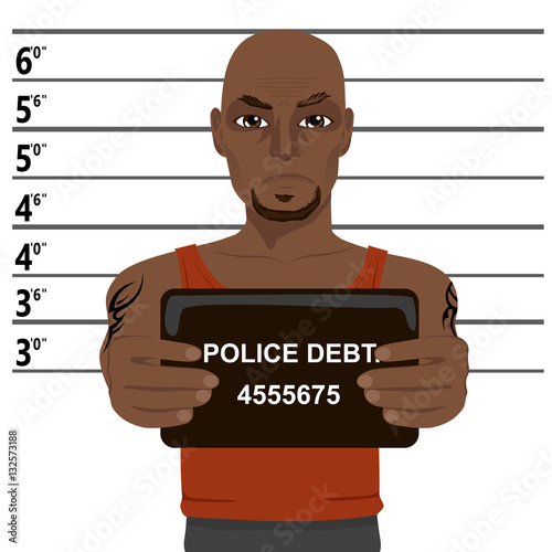 african american criminal with tattoos holding mugshot