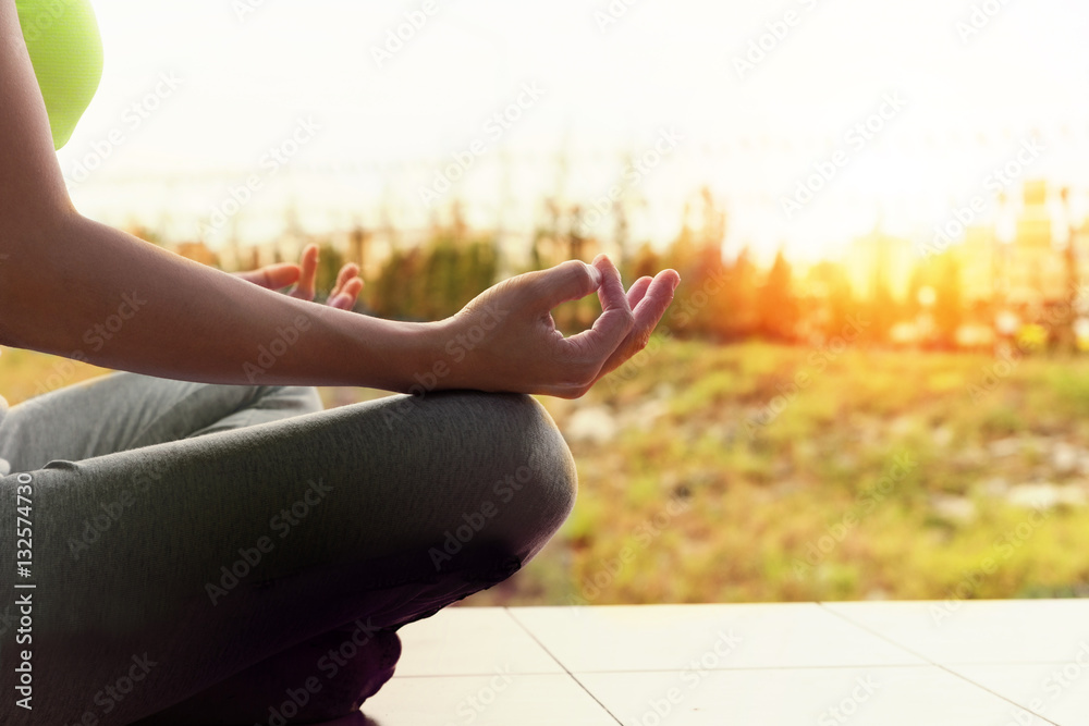 young woman meditates while practicing yoga outdoor in park, re young woman meditates while practicing yoga outdoor in park, re