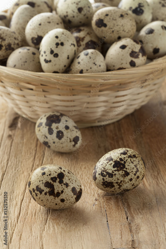 Basket with raw Quail eggs Basket with raw Quail eggs