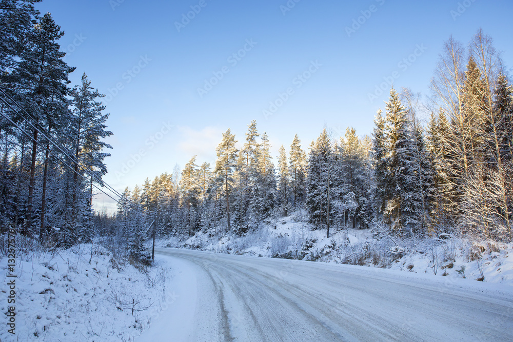 Traveling to the winter wonderland. An image of a snowy road in the countryside on a sunny winter day. Traveling to the winter wonderland. An image of a snowy road in the countryside on a sunny winter day.