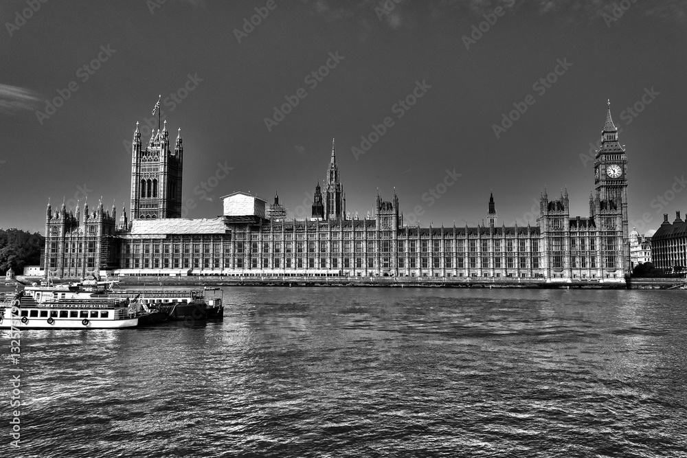 Looking across the Thames River towards the grand mock-Gothic architecture of the Palace of Westminster, London, England