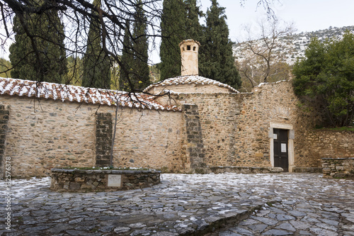 Old stone byzantine monastery in Kaisariani, Athens, Greece photo