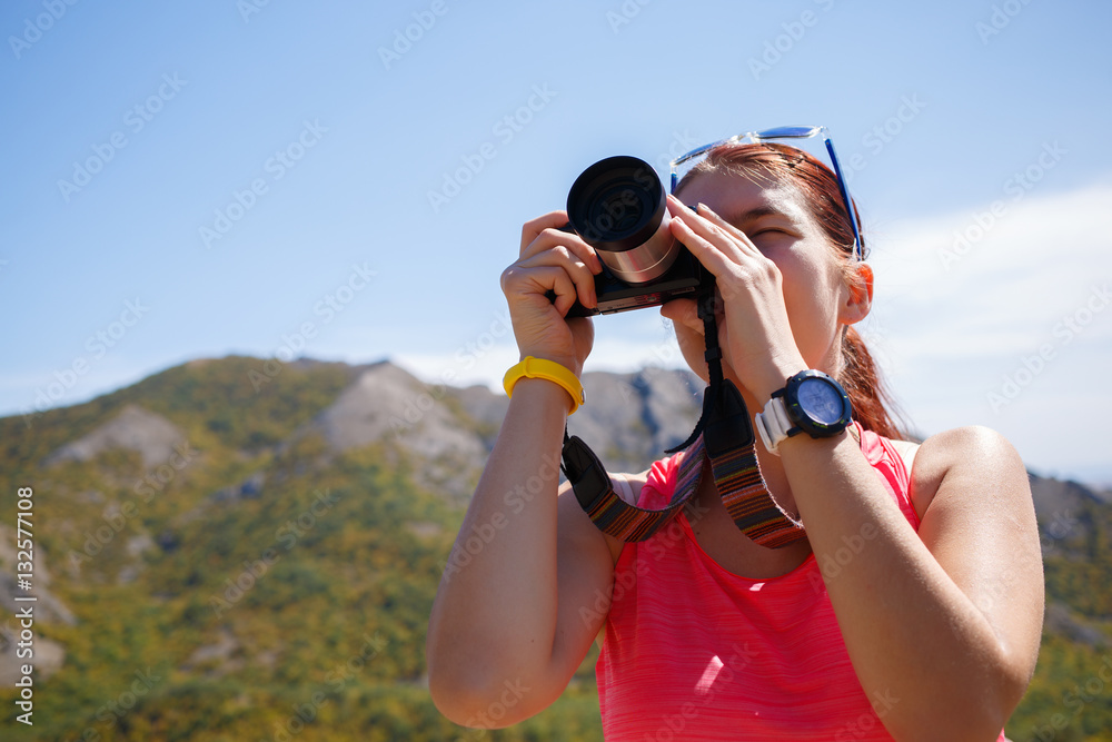Girl photographed background of mountain