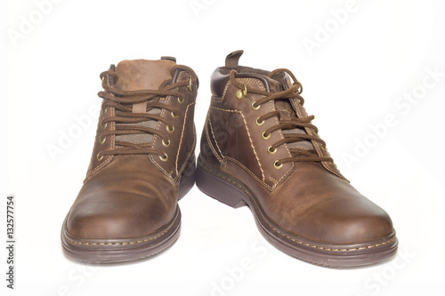 Brown man's leather boots isolated on white background. © nayladen