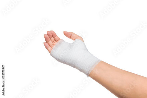 Injured painful hand with white gauze bandage. isolated on white