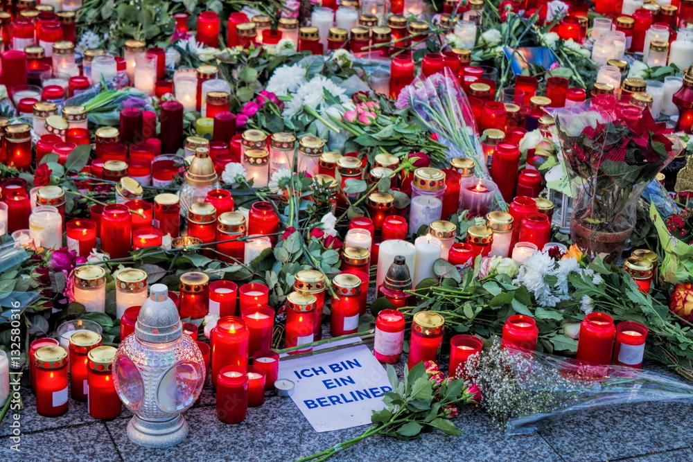 Fototapeta premium Candles and flowers for terror victims