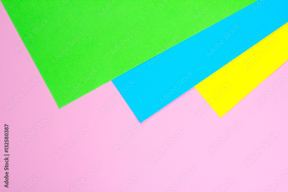 Material design yellow, blue, pink and green paper background. Photo. Material design yellow, blue, pink and green paper background. Photo.