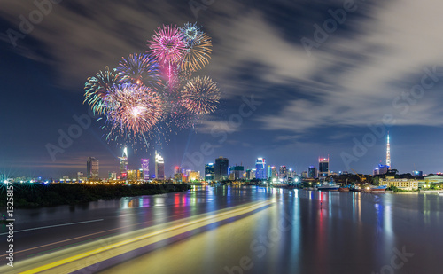 Fireworks over Business and Administrative Center with almost financial towers of Ho Chi Minh city by night, view from Thu Thiem Bridge. photo