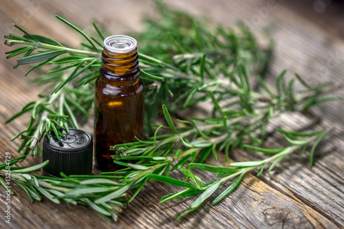 Rosemary essential oil and fresh rosemary