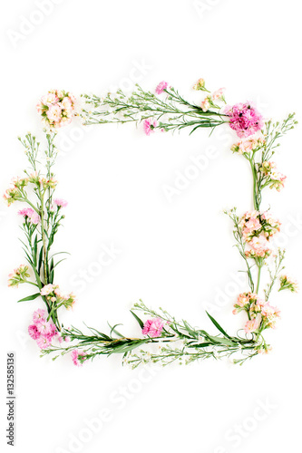 Wallpaper Mural Wreath frame made of pink and beige wildflowers, green leaves, branches on white background. Flat lay, top view. Valentine's background Torontodigital.ca