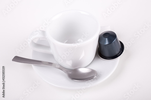coffee cup with capsule and spoon