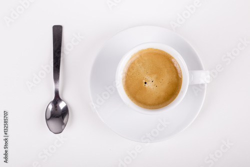 white cup of delucious coffee taken from top